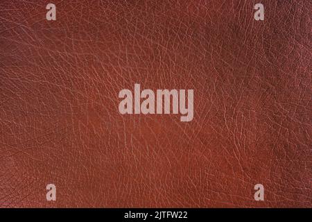 Natural, artificial brown leather texture background. Material for sport items, clothes, furnitre and interior design. ecological friendly leatherette Stock Photo