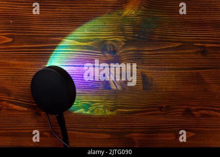 Sunset projector lamp on the table. Multi colored RGB light. Home decor. Copy space Stock Photo