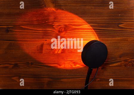 Sunset projector lamp on the table. Multi colored RGB light. Home decor. Copy space Stock Photo