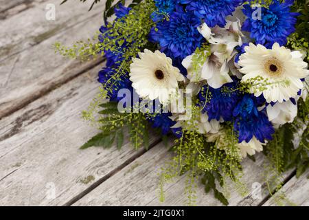 blue and white flowers bouquet with chrysanthemum. estonian flag colors - symbol of freedom Stock Photo