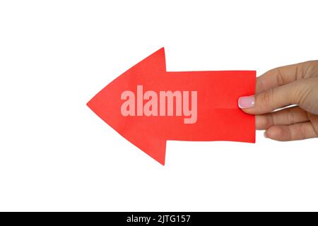 Red forward arrow in the girl's hand on a white background, red arrow sign Stock Photo