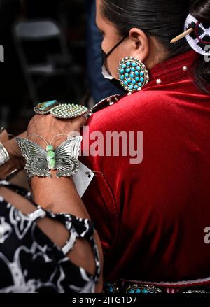 Native American women (Navajo) prepare to compete in the Native American Clothing Contest at the annualSanta Fe Indian Market in Santa Fe, New Mexico. Stock Photo