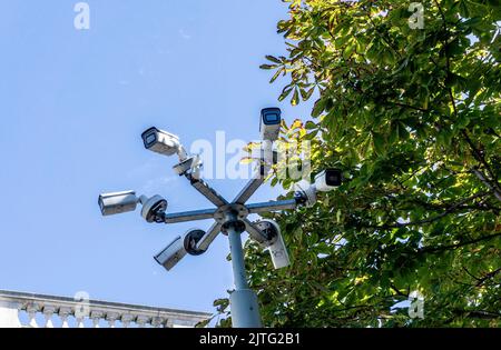 Big brother is watching you. A group of six cctv cameras watching all aspects of an area. Stock Photo