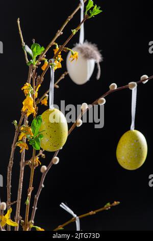 willow and forsythia branches with easter eggs Stock Photo