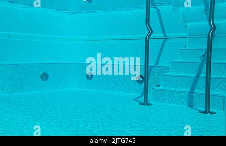 Underwater view of swimming pool with stairs. Stock Photo