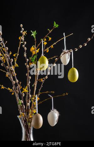 willow and forsythia branches with easter eggs Stock Photo