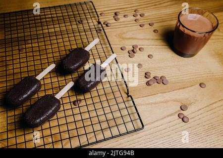 Beautiful candy bar decoration, cake in the form of ice cream with chocolate. Preparation of cupcakes Stock Photo