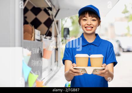 delivery woman with takeaway coffee cups Stock Photo