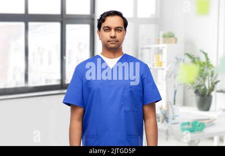 doctor or male nurse in blue uniform Stock Photo