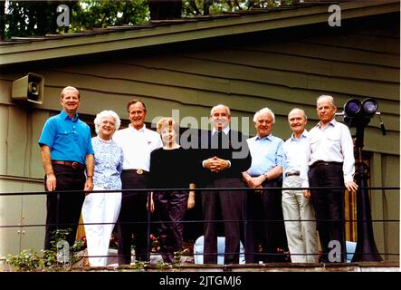 Camp David, Maryland - June 2, 1990 -- (Left to right): James A. Baker, III, United States (U.S.) Secretary of State; U.S. first Lady Barbara Bush; U.S. President George H.W. Bush; Union of Soviet Socialist Republics (U.S.S.R.) first lady Raisa Gorbachev; U.S.S.R. President Mikhail Gorbachev; U.S.S.R. Foreign Minister Eduard Shevardnaze; U.S. National Security Advisor Brent Scowcroft; and U.S.S.R. Marshal Sergei Akhromeyev pose for a group photo during their visit to the presidential retreat Camp David, Maryland on June 2, 1990.Credit: White House via CNP Stock Photo