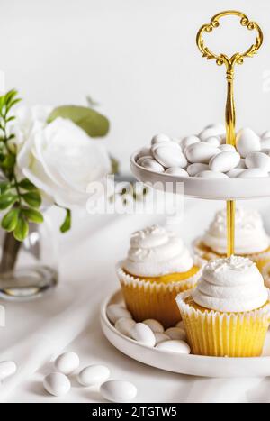 Vanilla cupcakes on a cake stand Stock Photo