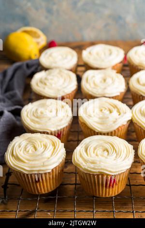 Raspberry muffins with lemon buttercream Stock Photo