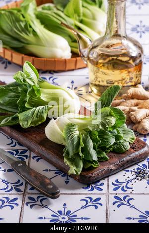 Fresh Bok Choy or Pak Choi (Chinese cabbage), with black sesame and vegetable oil, organic vegetables Stock Photo