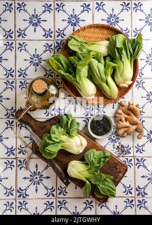 Fresh Bok Choy or Pak Choi (Chinese cabbage), with black sesame and vegetable oil, organic vegetables Stock Photo