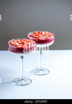 light airy berry mousse in glasses of red berries, delicate dessert Stock Photo