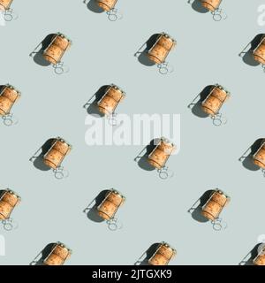 Pattern with champagne cork on blue background with shadow. Repeat pattern top view, flat lay, square composition. Summer drink, party and celebration Stock Photo