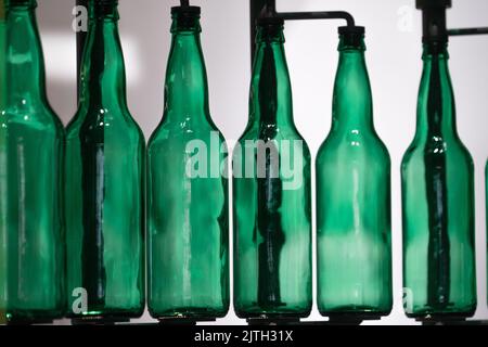 Row of see through green bottles Stock Photo