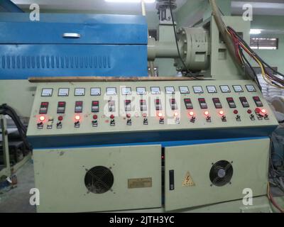 Kolkata, West Bengal, India - 16th May 2019 : State of the art modern machineries PE coating cup stock white Papers in a big Cup paper coating plant. Stock Photo