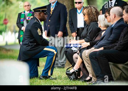 Arlington, Virginia, USA. 25th Aug, 2022. Sgt. Maj. Patrick Thomas (left), senior enlisted advisor, Arlington National Cemetery and Office of Army Cemeteries, offers condolences to Patricia Sargent following the funeral service of her father, Medal of Honor recipient U.S. Marine Corps Sgt. Maj. John Canley, in Section 60 of Arlington National Cemetery, Arlington, Va., August. 25, 2022. Credit: U.S. Navy/ZUMA Press Wire Service/ZUMAPRESS.com/Alamy Live News