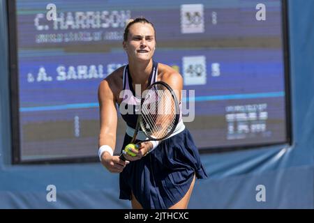 New York, NY - August 30, 2022: Aryna Sabalenka serves during US Open Championships 1st round match against Catherine Harrison of USA at Billie Jean King National Tennis Center Stock Photo