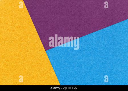 Texture of craft yellow, purple and blue shade color paper background, macro. Structure of vintage abstract cardboard with geometric shape and gradien Stock Photo
