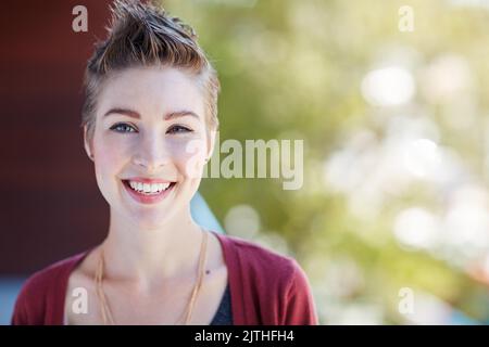 Success is what you make of it. Portrait of an attractive young businesswoman standing on her office balcony. Stock Photo