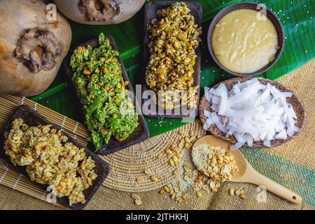 Krayasart in various flavors, sticky dessert, Thai dessert, made from rice, nuts, sesame, coconut and sugar in a basket, Close up Stock Photo