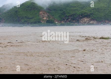 Due to heavy monsoon rains in summer, the river swat has turned into a flood Stock Photo