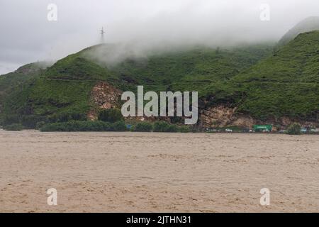 River swat submerge infrastructure after heavy flood in the valley Stock Photo