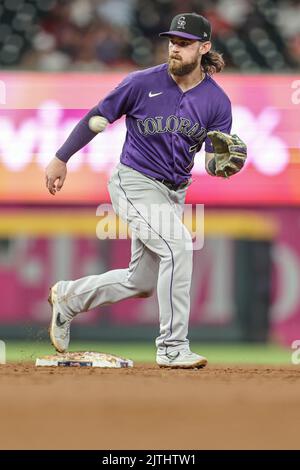 Atlanta, GA. USA;  Colorado Rockies second baseman Brendan Rodgers (7) fields a ground ball and throws to first for the out during a major league base Stock Photo