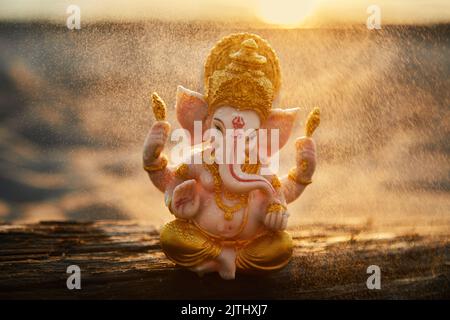 Lord ganesha sculpture on nature. Background for Ganesh chaturthi Festival celebration. Stock Photo