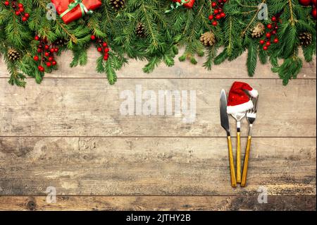 Christmas menu mockup. Christmas, New Year table place setting. Mockup of Christmas or New Year invitation card on dark wooden table, copy space for F Stock Photo