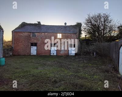 Very old stable block on a farm Stock Photo