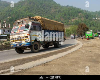 LEH LADAKH , INDIA - AUGUST 11 : The big colorful trucks are on altitude road in Leh Ladakh,India on August 11, 2015. Stock Photo