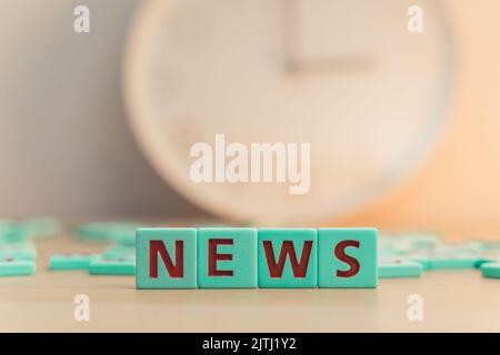 The word NEWS made of small colorful cubes with letters. . High quality photo Stock Photo