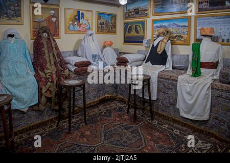 Typical interior room with models made out of textilles  and showing traditional furnishings from each province in Saudi Al Tayebat museum Jeddah Saudi Arabia Stock Photo