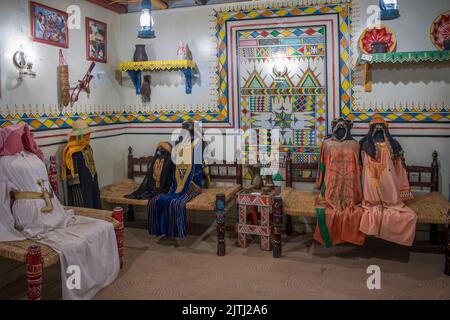 Typical interior room with models made out of textilles  and showing traditional furnishings from each province in Saudi Al Tayebat museum Jeddah Saudi Arabia Stock Photo