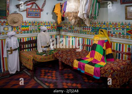 Typical interior room with models made out of textilles  and showing traditional furnishings from each province in Saudi Al Tayebat museum Jeddah Saudi Arabia Stock Photo