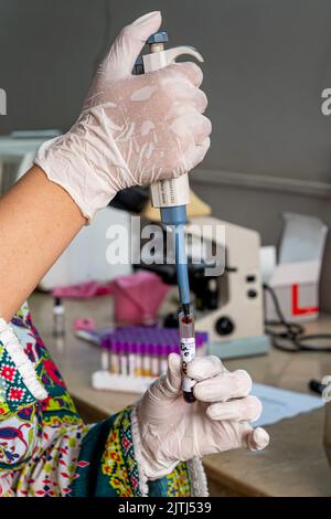Sample Yuve Concept of biology research, test tube and flowers isolated on white ...