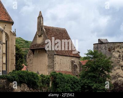 SANKT MICHAEL, AUSTRIA - JULY 13, 2019:  Exterior view of the  ossuary (Karner) of the fortified church of Wehrkirche St. Michael Stock Photo