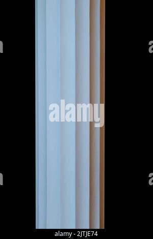 white stone column isolated on black background Stock Photo