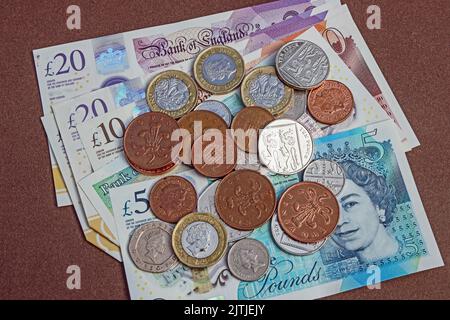 British bank notes and cash. Talk of loose cash disappearing by card use Stock Photo