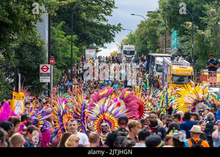 Notting Hill Carnival Grand Parade, on August Bank Holiday Monday 2022 in London, UK. Participants and trucks gathering in Ladbroke Grove Stock Photo