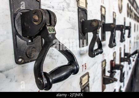 Retro electrical circuit breakers on the control panel Stock Photo