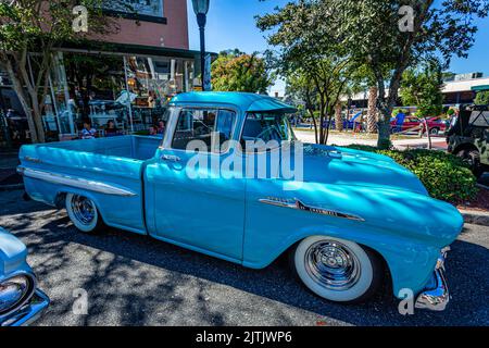 Fernandina Beach, FL - October 18, 2014: Wide angle side view of a 1958 Chevrolet Apache 31 Pickup Truck at a downtown classic car show. Stock Photo