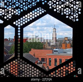 Hexagon views over to Holy Trinity Church clock tower from car parking, at Time Square, Warrington town centre, Cheshire, England, UK, WA1 2HN Stock Photo