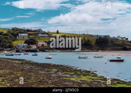 Clonakilty, Ireland, July 2, 2022. The coast of Ireland. Small fishing boats are anchored in Clonakilty Bay at low tide. Picturesque seascape. Europea Stock Photo