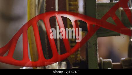 Image of dna strand over mechanism Stock Photo