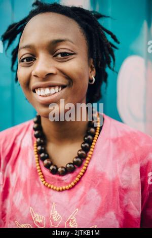 Portrait of smiling young woman Stock Photo