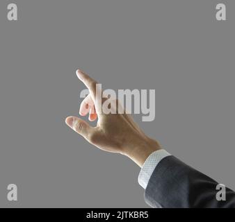 Right hand and forearm of a businessman with gray suit jacket sleeve with white shirt, pointing forward up showing touching something gesture. Isolate Stock Photo